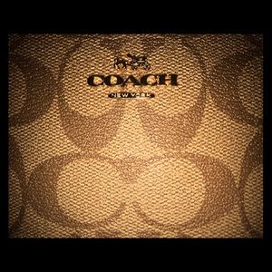 Coach wristlet. Excellent new condition.